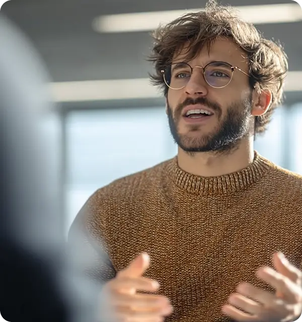 Man talking and gesturing during discussion