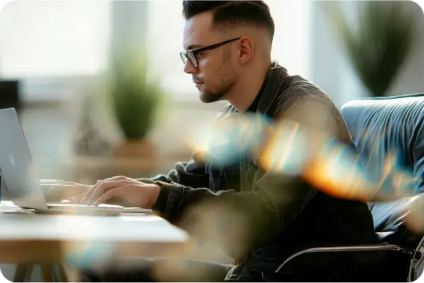 Man working on laptop in modern office