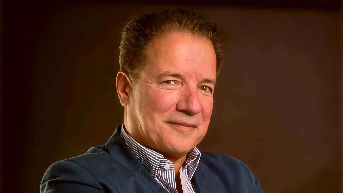 Smiling man in a blue jacket portrait